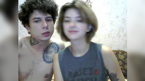 Tattooed muscular stud fucks a blonde camgirl from behind